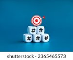 3d goal target icon on top of white cube block stack pyramid shape with hashtag icon symbol blocks isolated on blue background, minimalist. Business digital marketing and social media trends concept.