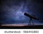 Silhouette of telescope and starry night sky in background. Astronomy and stars observing concept.