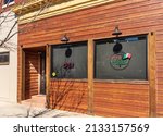 Small photo of GASTONIA, NC, USA-3 MARCH 2022: Front, entrance and signs at the Viva Tquis Taqueria and Cantina, on Main St.