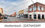 Small photo of BURLINGTON, NC, USA-2 JAN 2023: Wide angle view of Front Street from Main Street toward Spring Street, showing Burlington Beer Works, Smitty's and other businesses.