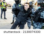 Small photo of Moscow, Russia - 2022.02.27 - police officers detain a man on Pushkin Square at rally agains special military operation in Ukraine