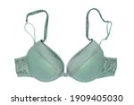 Bra isolated. Closeup of beautiful female stylish turquoise bra with straps and dots pattern isolated on a white background. Fashionable women underwear.