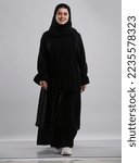 Small photo of Sahafa Riyadh, Kingdom of Saudi Arabia, Woman wearing black abaya and walking