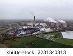 Small photo of DRAX POWER STATION, UK - JUNE 20, 2022. An aerial view of Drax Power Station's depleted coal stack near Selby in North Yorkshire generating non renewable electricity as a coal fired power station