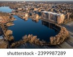 Aerial view of a new housing development with luxury properties overlooking a lake in the lakeside District of Doncaster, UK