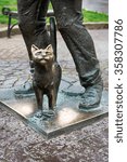 Small photo of Mukachevo, Ukraine - April 6, 2015: Monument of Happy Chimney Sweeper and his cat. The monument with real chimney sweeper Bertalon Tovt by Ukrainian sculptor Ivan Brovdi