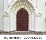 Old Arched Door To An Old Church