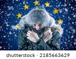 Transition to renewable energy sources. Energy crisis in Europe. A citizen of Europe freezes in front of the flag. Increase in the price of natural gas for home heating.