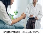 Small photo of Asian psychology doctor examine and listen to woman patient at home. Attractive beautiful female physician give advise and consult to help young girl solve problem for Psychologic health care in house