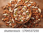 Wooden Bowl With Mixed Nuts On...