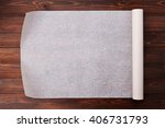 Baking paper on wooden kitchen table for menu or recipes, top view