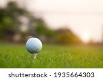 golf ball on tee in a beautiful golf course with morning sunshine.Ready for golf in the first short.Sports that people around the world play during the holidays for health.