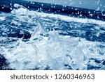 Small photo of A small wave going ashore with foam