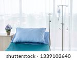 Small photo of Clean and fully equipped modern hospital room. This is a standard bed for sick patients . Emergency case can be admitted. Copy space provided. Insurance and health care concepts.