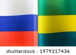 Small photo of fragments of the national flags of Russia and the Gabonese Republic close-up
