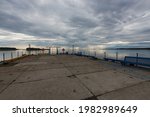 Small photo of View from the pier to the calm sea. Solovetsky Island. Translation of the inscription: "Tatiana's Pier"