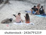 Small photo of Rio de Janeiro-Brazil, July 15, 2010, Lionel Messi and Antonela Roccuzzo (wife) during their honeymoon in Brazil, on Grumari beach in the west zone of the city of Rio de Janeiro