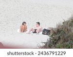 Small photo of Rio de Janeiro-Brazil, July 15, 2010, Lionel Messi and Antonela Roccuzzo (wife) during their honeymoon in Brazil, on Grumari beach in the west zone of the city of Rio de Janeiro