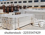 Small photo of A stack of pdn road slabs at a factory warehouse