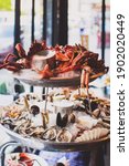 Small photo of French 2 tiers seafood platter with dry ice on top and smoke coming down. Seafood including Tasmanian giant crab, raw oysters, scallop, shrimps, king prawns and mussels.