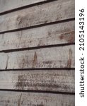 Small photo of wooden slats of home exterior wall or cabin rust colored horizontal wooden slat wall with wood grain horizontal slats close up rustic background room for type vertical format