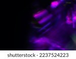 Small photo of Blur neon light. Lens flare overlay. Bokeh fluorescent flash gleam. Defocused blue purple color flecks on dark black abstract background.