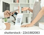 Small photo of Customer use smartphones to scan QR codes to pay in-store with digital payments without cash. scanning get discounts. E wallet, technology, online payment, banking app, smart city, money transfer.