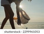 Small photo of Save ocean. Volunteer pick up trash garbage at the beach and plastic bottles are difficult decompose prevent harm aquatic life. Earth, Environment, Greening planet, reduce global warming, Save world