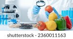 Small photo of Scientist check chemical fruit residues in laboratory. Control experts inspect the concentration of chemical residues. hazards, standard, find prohibited substances, contaminate, Microbiologist