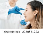 Small photo of plastic surgery, beauty, Surgeon or beautician touching woman face, surgical procedure that involve altering shape of nose, doctor injection to prepare for rhinoplasty, medical assistance, health