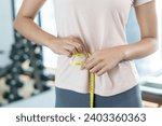 Small photo of Diet and dieting. Beauty slim female body use tape measure. Woman in exercise clothes achieves weight loss goal for healthy life, crazy about thinness, thin waist, nutritionist.