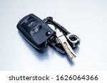 Close-up dirty broken or damaged car key fob on aluminium background locksmith service.- Image