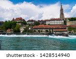 Bern City Switzerland Aarau Aare river side view of the Cathedral sunny day with clouds