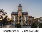 Small photo of Brussels, BELGIUM - October 8, 2021: Twon Hall of Anderlecht at sunset. Families and people enjoying the sunset at town hall square