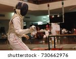 Small photo of Fencer duelist is on guard preparing to fight in fencing sport