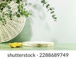 Small photo of Empty wooden podium with lemon slices on blue background with eucalyptus leaves. Natural display for presentation. Sustainable showcase for eco new home cleaning or laundry products and promotion sale