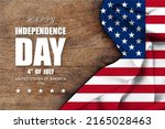 USA Independence Day 4th of July. American flag wave on wood background