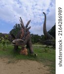 Small photo of PAHANG, MALAYSIA - MARCH 2ND 2022 : Dinasour Park at Kuantan Pahang give best experience fun for kids to learning about dinosaur.