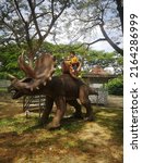 Small photo of PAHANG, MALAYSIA - MARCH 2ND 2022 : Dinasour Park at Kuantan Pahang give best experience fun for kids to learning about dinosaur.