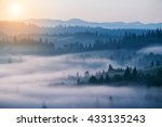 beautiful landscape with mountain view and morning fog on sunrise.  natural summer background