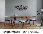 Modern dining room interior with glamour wooden table , stylish chairs and design decoration. Template. Home decor. 