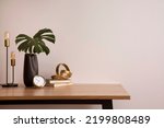 Minimalist composition of elegant home office space with design chair, black vase with leaf, sculpture, book and personal accessories. Copy space. Minimalist home decor. Template.	
