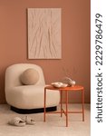 Small photo of Aesthetic interior of living room with mock up poster frame, beige armchair, round orange coffee table, rug, slippers, sculpture, vase with dried flowers and personal accessories. Home decor. Template