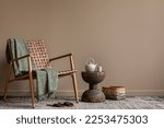 Small photo of Aesthetics composition of living room interior with copy space, stylish armchair, green plaid, wooden coffee table, beige pitcher, cup, slippers, basket and personal accessories. Home decor. Template.