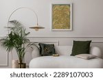 Small photo of Cozy composition of living room interior with mock up poster frame, white sofa, green pillows, gold trace, plants, beige lamp, wall with stucco and personal accessories. Home decor. Template.