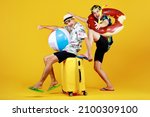 Small photo of Naughty Asian boy enjoys sitting on luggage and exciting to travel to beach and sea to play fun water sport with float ball together with friend in swimming tube and snorkel for outdoor scuba diving.