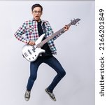 Small photo of Portrait shot of young teenage musician playing the bass guitar with emotion in studio. Professional young junior bassist holding bass guitar and looking at camera isolated with white background