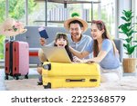 Small photo of Millennial Asian lovely happy family father mother and young little girl daughter helping packing stuff in trolley luggage preparing to travel on summer vacation reserving hotel and airplane ticket.