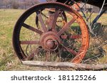 Rusted Iron Wheel On A Field
