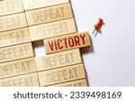 Small photo of Vernier caliper with word victory vs defeat.Antonym concept
